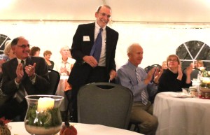 Dr. Streck acknowledges applause at Pathfinder Village reception in his honor.