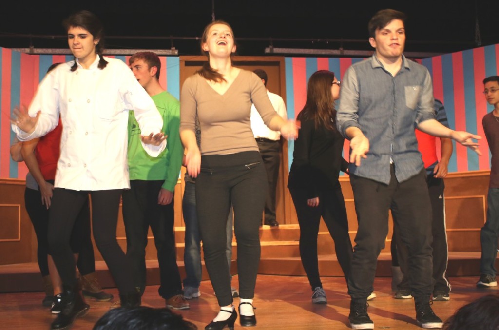 Students, from left, Alina Bischoff, Lindsay Brown and Vaughan Powers warm up in the “Drowsy Chaperone’s” finale.