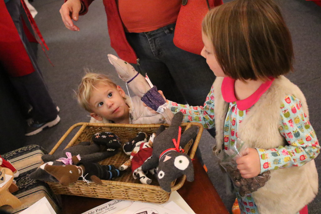 As the holidays approach, gift hunters turn to the local wears of artists at craft shows this weekend. Here, sisters Annika and Adella Koehn look through a box of plush kittens. (Ian Austin/AllOTSEGO.com)