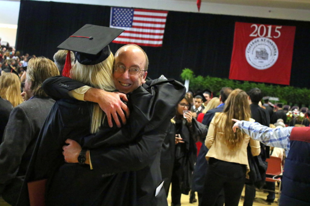 Kevin Horan, New Windsor, hugs his daughter Kristyn, following SUNY's December Candidate Recognition at the Alumni Field House this morning. President Nancy Kleniewski praised the class for their work in area volunteering; citing blood drives, neighborhood clean-ups and more. "It is my hope you take this mentality with you out into the world." she said. (Ian Austin/AllOTSEGO.com)