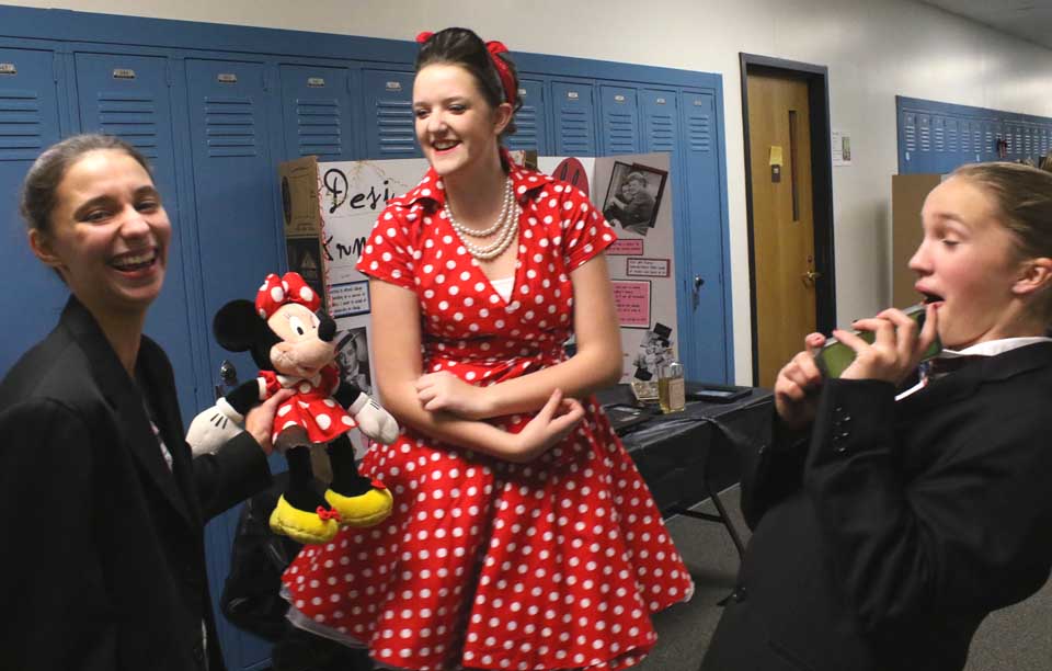 Ashley Kiuber, right, played Desi Arnaz to Morgan Kelly's Lucille Ball last evening at CCS' Night of the Notables, when eighth graders take on the personae of famous people from American history or current society. At left is Walt Disney himself (Sarah Johnson). Click through for more photos of the famed. (Jim Kevlin/AllOTSEGO.com)