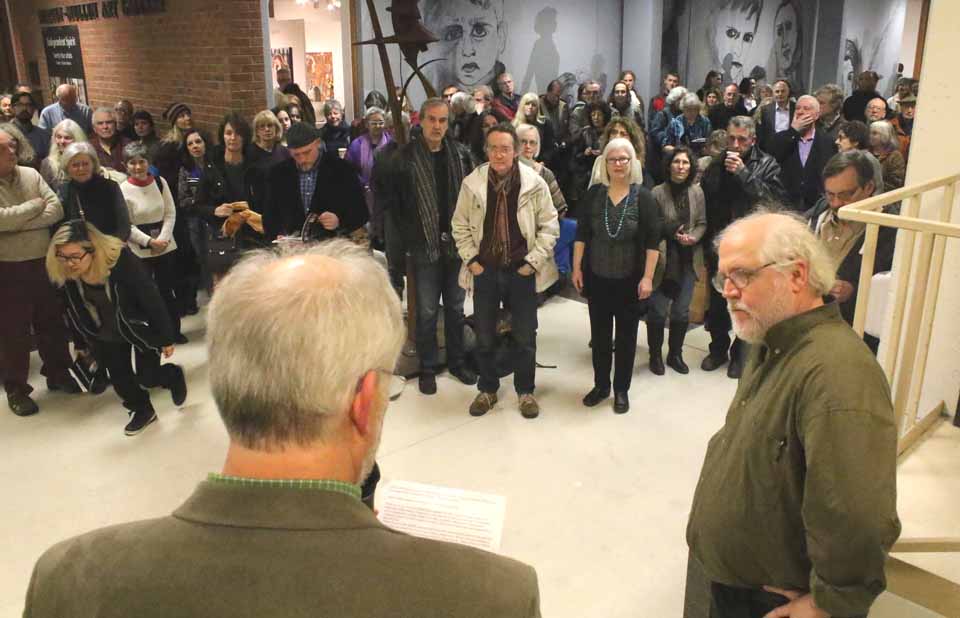 Thursday evening, the SUNY Oneonta's Martin-Mullen Gallery was the place to be for the art community, as perhaps 200 people packed the opening reception of "Independent Spirit," featuring two dozen artists from within 30 miles of Cooperstown, Here, Charlie Bremer, right, the Otego artist and the show's organizer, is introduced for a short "gallery talk" on the exhibit, with may be viewed through March 18. (Jim Kevlin/AllOTSEGO.com)