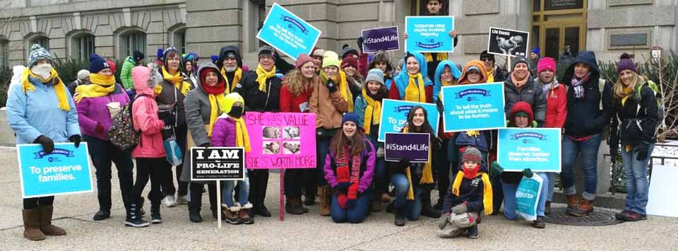 A contingent from Otsego and Delaware counties at today's "March for Life" in Washington D.C. wave their placards in elation. The local marchers departed by bus early today for the nation's capital. (Jean Naples photo)