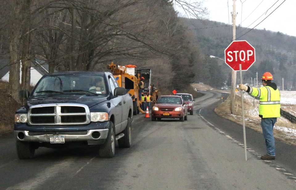 Traffic was down to one lane on Route 29 south of Cooperstown this afternoon as county road crews cut back trees in the vicinity of the Clark Foundation Scholarship Office. (AllOTSEGO.com photo)