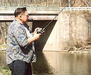 Ray Winchester fishing at his camp near Wells Bridge.