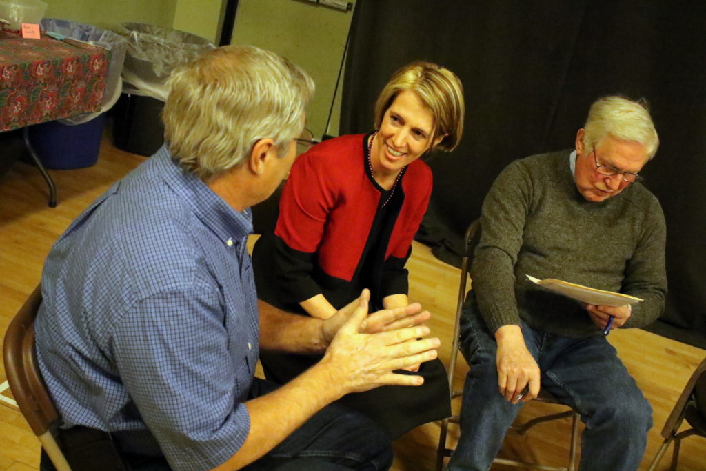 Zephyr Teachout, Congressional Candidate for NY's 19th District, center, listens to the concerns of Stuart Anderson, Otego, left, and Fred Lanfear, Oxford, right, at an Oneonta Town Hall meeting held at Foothills this afternoon. Teachout spoke on her background and her main focuses, which included high speed internet for all, distribution hubs, hydro systems and more. But, she also stressed the importance of 'listening to the man behind the counter', and discussed the concerns of the audience in a meet and greet session following her talk. Teachout will also be speaking at Ommegang later today. (Ian Austin/AllOTSEGO.com) 