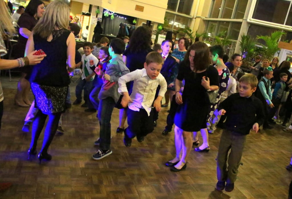 Emma Spinoza, Oneonta, gets down on the dance floor with her sons Theo, left, and Marco, at the Shamrock Swing dinner and dance for mothers and sons at Foothills this evening. (Ian Austin/AllOTSEGO.com)