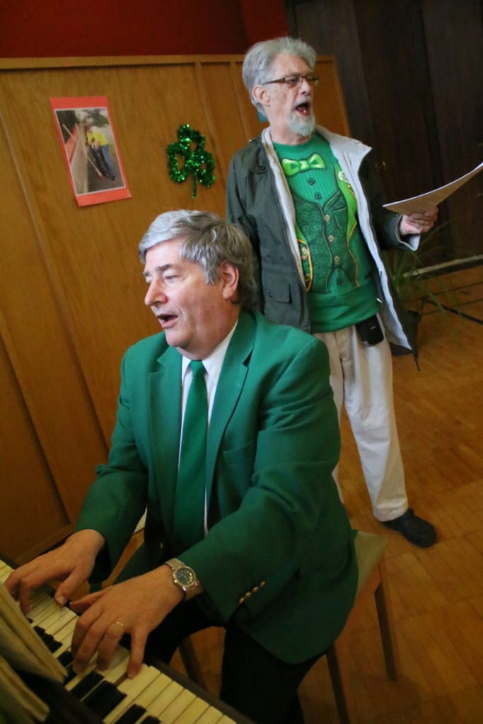 Dr. Craig Marrow, Cooperstown, on piano, and Jim Hanson, Oneonta, lead the dinner revelers at St. James' Irish Night dinner in a rendition of "Sweet Rosie's Baby." Guests enjoyed traditional Irish fair, as well as a performance by the Damsha Beatha Irish Dance Troupe. (Ian Austin/AllOTSEGO.com)
