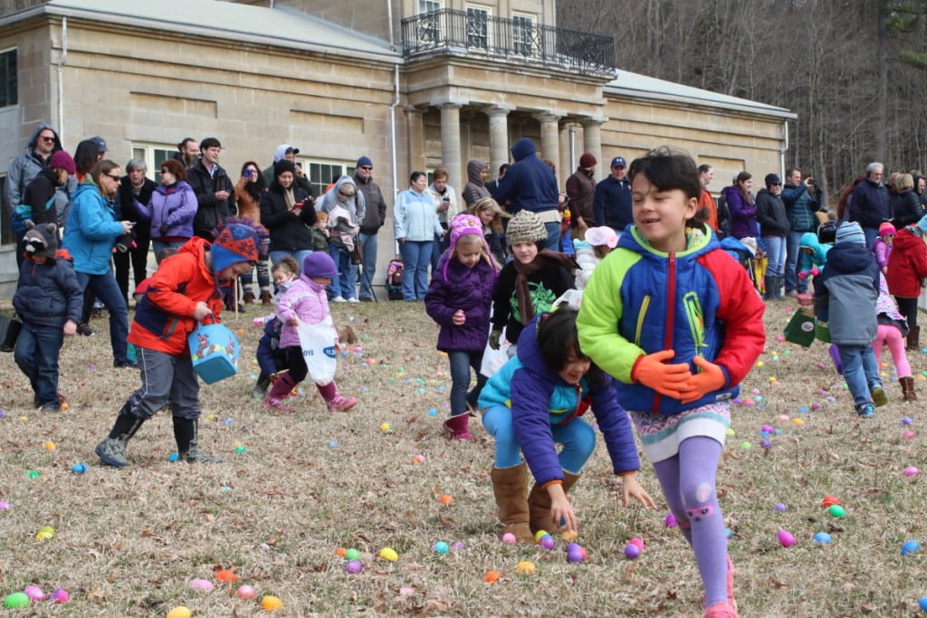 Henry Cooper, left, and the Badgley twins Lillian and Naomi, Cooperstown, rush across the lawn of Hyde Hall during their annual Easter Egg hunt this morning. The event, which is sponsored by the Leatherstocking Federal Credit Union, had 677 attendees, a new record, who collected over 6000 eggs in hopes of finding one of three special eggs, which would win you the Easter basket. (Ian Austin/AllOTSEGO.com)