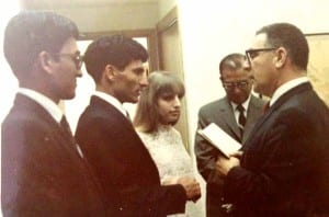 Almost two years after meeting, the couple are wed by a JP in Honolu. Nina's father, Jack Finestone, is in the background.