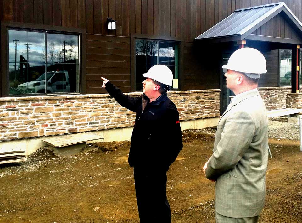 Northern Eagle Beverage President George Allen, left, shows U.S. Rep. Chris Gibson, R-19, the nearly complete Hager Hops brewery on Browne Street, Town of Oneonta, during a tour of the county today. Gibson also met with church leaders in Gilbertsville.