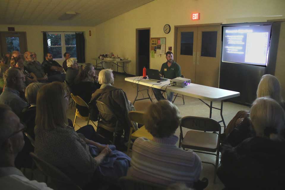 When they weren't peppering DEC Senior Wildlife Biologist Mike Clark with questions, more than 50 people sat rapt for more than an hour this evening in the New Lisbon Town Hall, listen to the saga of the fisher's return. (Jim Kevlin/AllOTSEGO.com)