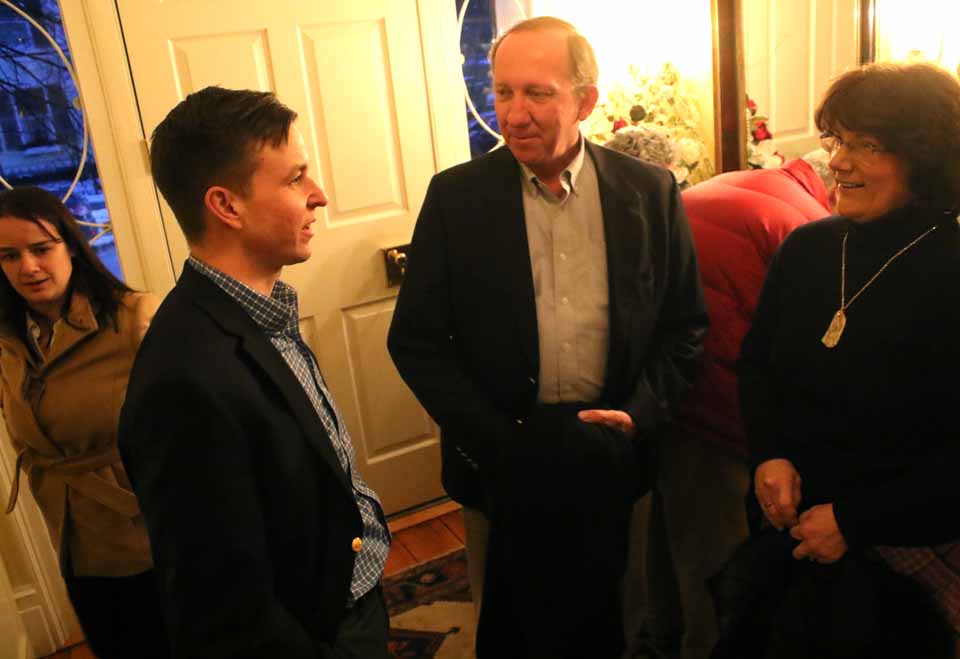 Congressional candidate Will Yandik chats with former Otsego Town Supervisor Tom Breiten and his wife Leslie, on arriving a few minutes ago at a reception in his honor at the Cooperstown home of Melinda Hardin and Lou Allstadt. Yandik, a farmer and Livingston town board member in Ulster County, is vying with Zephyr Teachout in the April 19 Democrat primary for the 19th District seat being vacated by the retirement of U.S. Rep. Chris Gibson, R-Kinderhook. The Democratic county committee endorsed Teachout on Feb. 10, but his appearance at the Cooperstown caucus won over a number of attendees. Yandik was also in Otsego County yesterday, meeting with Oneonta Democrats at a luncheon at Stella Luna. (Jim Kevlin/AllOTSEGO.com)