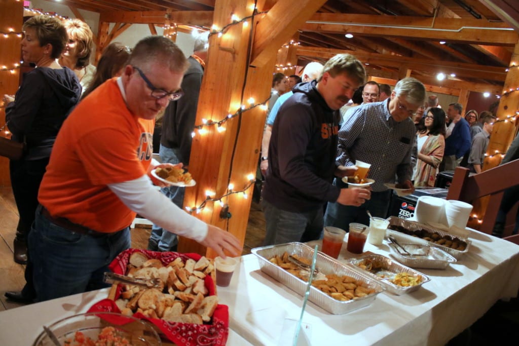 Oneonta's Bill Stamp Todd Forman and Art Torrey load up on appetizers a the 5th annual Taste of Life fundraising event for the Oneonta YMCA. The sold-out dinner hosted 250 people at the Carriage House, and included a silent auction, live music by the Jim &Bo Trio, pork tenderloin dinner, as well food selections from Sloan's, Bella Michael's, Sudexo, J & B Custom Catering and Tulip and Rose. (Ian Austin/AllOTSEGO.com)