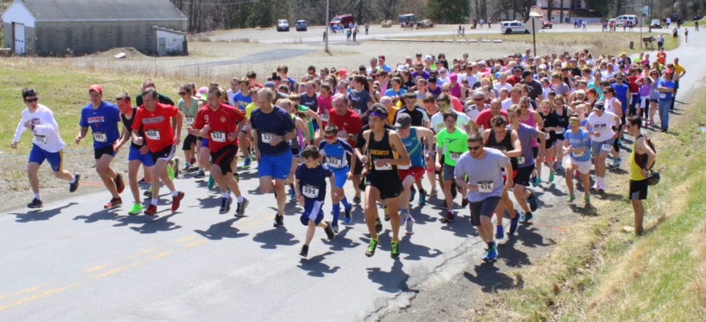 Alex Kahl, Mike Hamilton, Scott Hornung, Steve Hornung, Tom Slicer, Richard Sloman, Paul Zimmer, and Adam Nichols lead the charge as 477 runners of the 18th annual 5k take off up East St. this afternoon. Mike Hamilton took fist place over-all with a time of 17:44. (Ian Austin/AllOTSEGO.com)
