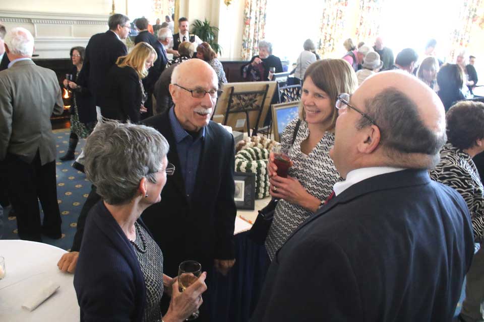 Retired SUNY Oneonta President Alan Donovan and his wife, Ann, left, chat with County Judge Brian Burns and his wife Elizabeth at the annual Epicurean Festival at The Otesaga to benefit Catskill Area Hospice.  Hospice CEO Lola Rathbone said a record 380 attendees registered for the annual event.  (Jim Kevlin/AllOTSEGO.com)