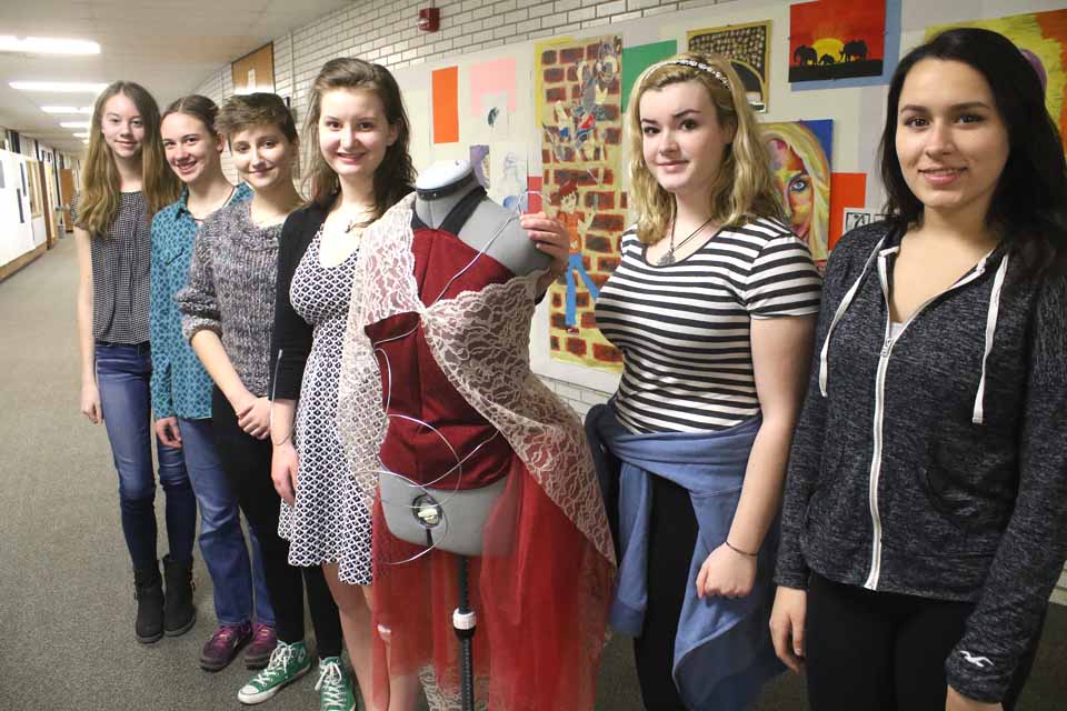Couturiers preparing for CCS’ Cooperstown Fashion Show at 7 p.m. Thursday, April 21, are, from right, 11th graders Megan Lohan, Rachel Carpenter and director Lindsay Brown (standing next to one of her creations); 10th grader Ilsa Dohner, Lindsay’s assistant; and eighth graders Mikeeli Hanson and Kara Gildea. The show will be in the school’s Sterling Auditorium, followed by a reception. Admission $5. (Jim Kevlin/AllOTSEGO.com)
