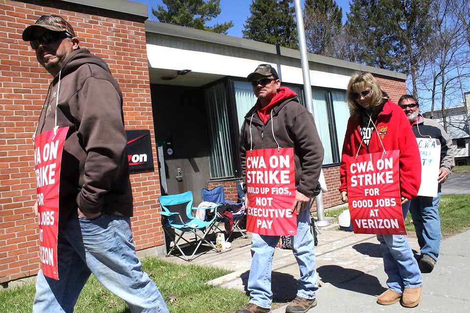 Walking the picket line in front of the Verizon building on Pioneer Street, Cooperstown, are, from left, Bill Barker, Mount Vision; Rob Benson, East Springfield; Lynn Farrell, Oneonta, and Steve Bridger, Cooperstown,