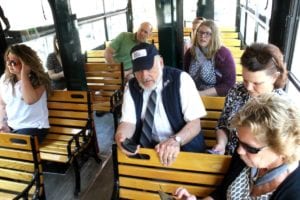 At least Mayor Katz (in green shirt) was taking in Cooperstown's nationally known features. Everyone else on the inaugural ride had eyes glued to tiny screens to chart the trolley's progress.