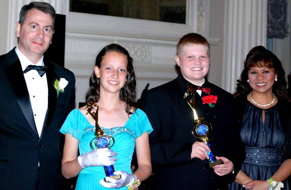 Each year, the Corinne Hillman Award is presented to one eighth grade young lady and one eighth grade gentleman who show an aptitude for the new dance steps that they learned during the Monday evening classes, but also show respect for themselves, their peers in class, the adult chaperones and the dance instructors. The award is named for long-time Cooperstown Cotillion dance instructor, Corinne Hillman. Corinne led the Monday evening classes for over 30 years. This year, the award was presented to Miss Nora Jensen and Mr. Logan Doucas.
