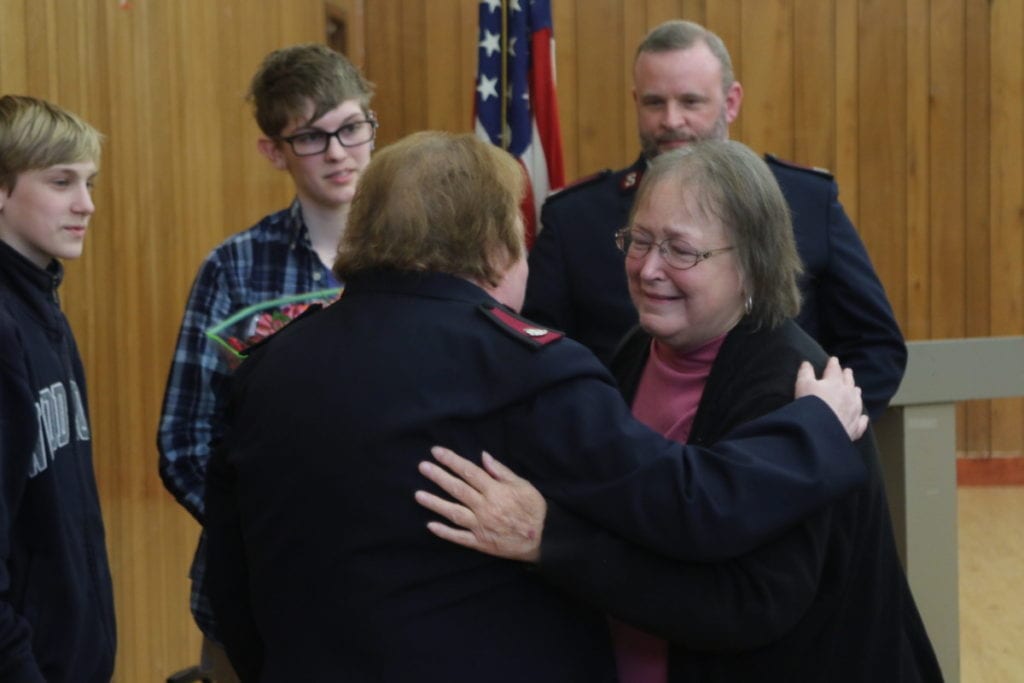 Sharon Haines, right, a 42-year veteran of the Salvation Army, embraces Major Sharon Hartford at the conclusion of today's Volunteer Recognition Ceremony, where Haines was honored with the "Others" Award for her service to the community. (Ian Austin/AllOTSEGO.com)