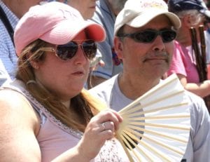 Saturday's record high of 88 had Elysia Hinkley of Spencerport waving her fan at the Hall of Fame Classic. (Jim Kevlin/AllOTSEGO.com)