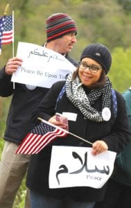 Oneonta Council member Michelle Osterhoudt, who later read a proclamation from Mayor Gary Herzig in support of Islamberg, and husband Marty, await the arrival of the "American Bikers United Against Jihad."