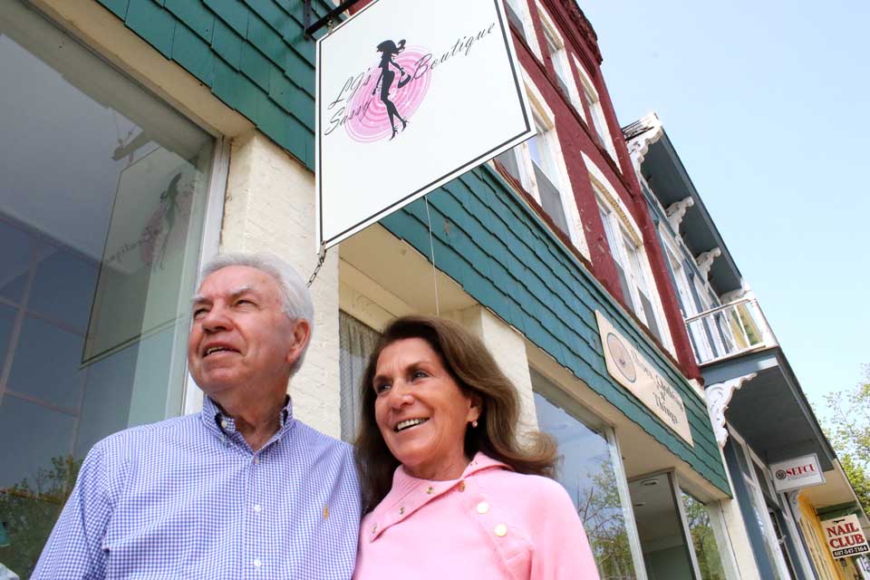 Laura Jane and Wayne Alexander's new sign, "LJ's Sassy Boutique," has been installed at 165 Main St., but a "Village Cobbler" sign remains in place, at least for this summer, to signal customers the couple and quality shoes are still part of the mix.  (Jim Kevlin/AllOTSEGO.com)