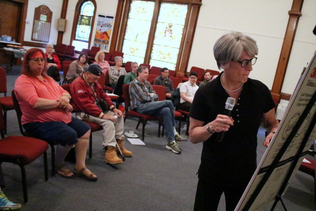 Juli Grey-Owens, Executive Director of the Long Island Transgender Advocacy Coalition, jots down ideas given at the Transgender and Gender Non-Conforming Town Hall meeting, held earlier tonight at the UU Church in Oneonta. During an "Open Mic" session, participants offered up ideas on how to bring the transgender community together in rural Otsego county, including a community center, increased visibility and support for mental health services. (Ian Austin/AllOTSEGO.com)