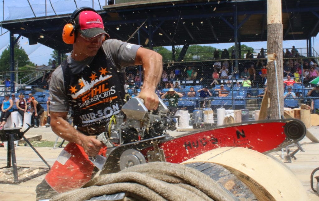 Nathan Waterfield, Cherry Valley, organizer of the lumberjack competition held in Damaschke Field this weekend in the Hot Shots event where competitor try for best time in cutting through a 23" thick log in seconds. The saw he is using is customized and features a snow mobile engine. Then event, no win it's second year, featured 24 men and 10 women. "It's as rather obscure sport." said Waterfield, "So, the fact we are having this means we have people coming in from all over."(Ian Austin/AllOTSEGO.com)