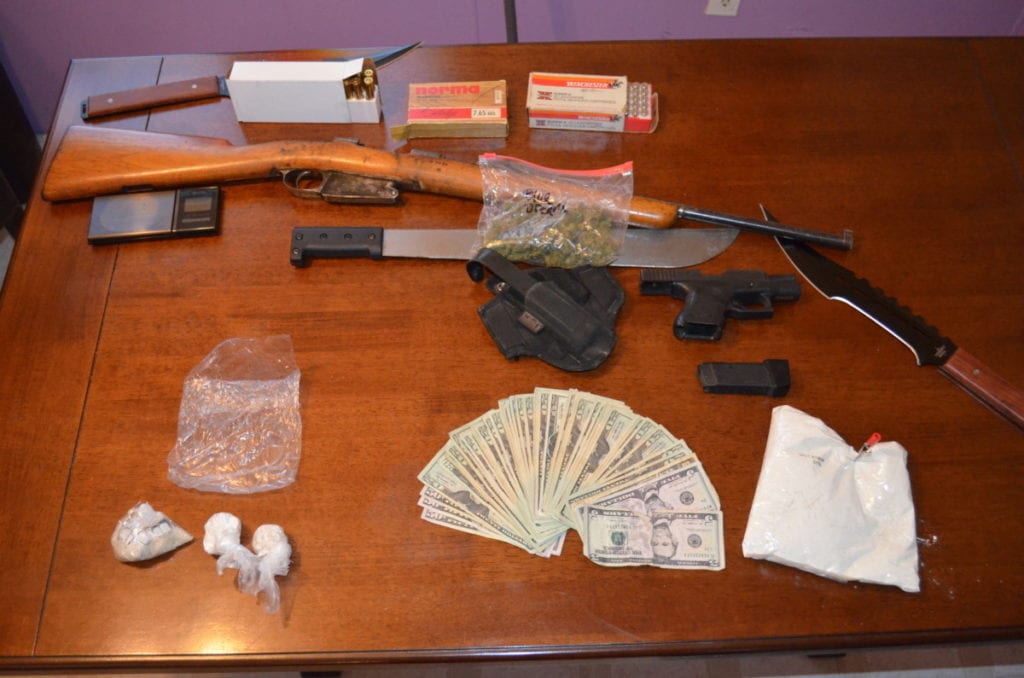 Cash, drugs and weapons were seized yesterday in a the Worcester mobile home of Paul James Velleca, a convicted felon.