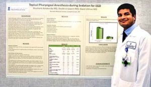 Dr. Kotakonda and his research poster board.