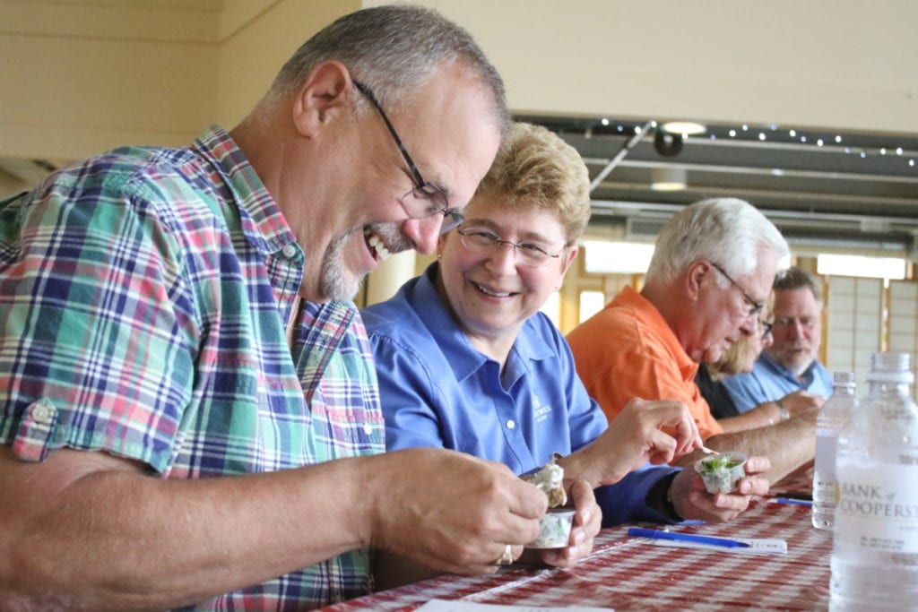 Judges "Big Chuck' D'Imperio and Hartwick College president Margaret Drugovich took the task of sampling 13 meatballs from Oneonta restaurants very seriously, naming Sauced the winner of Destination Oneonta's Best Meatball contest. Late afternoon showers moved the Fabulous Friday event. which also featured beer tastings, face paintings and music by Buffalo and Brandy, to the Foothills Performing Arts Center. (Ian Austin/AllOTSEGO.com)