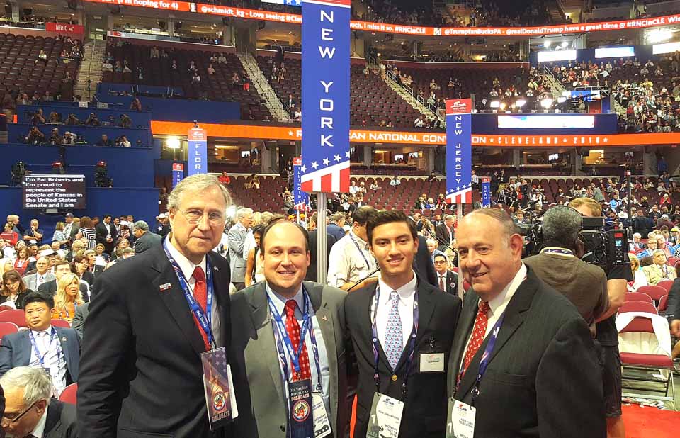 Jacob Russell, Cooperstown, a page at the Republican National Convention in Cleveland, which opened today joins, from left, State Chairman Ed Cox, Erie County Chairman Nick Langworthy and Tony Casale, Cooperstown, the retired Assemblyman on the convention floor in the Quicken Loans Center. Russell, a CCS grad, has just completed his freshman year at Harvard.