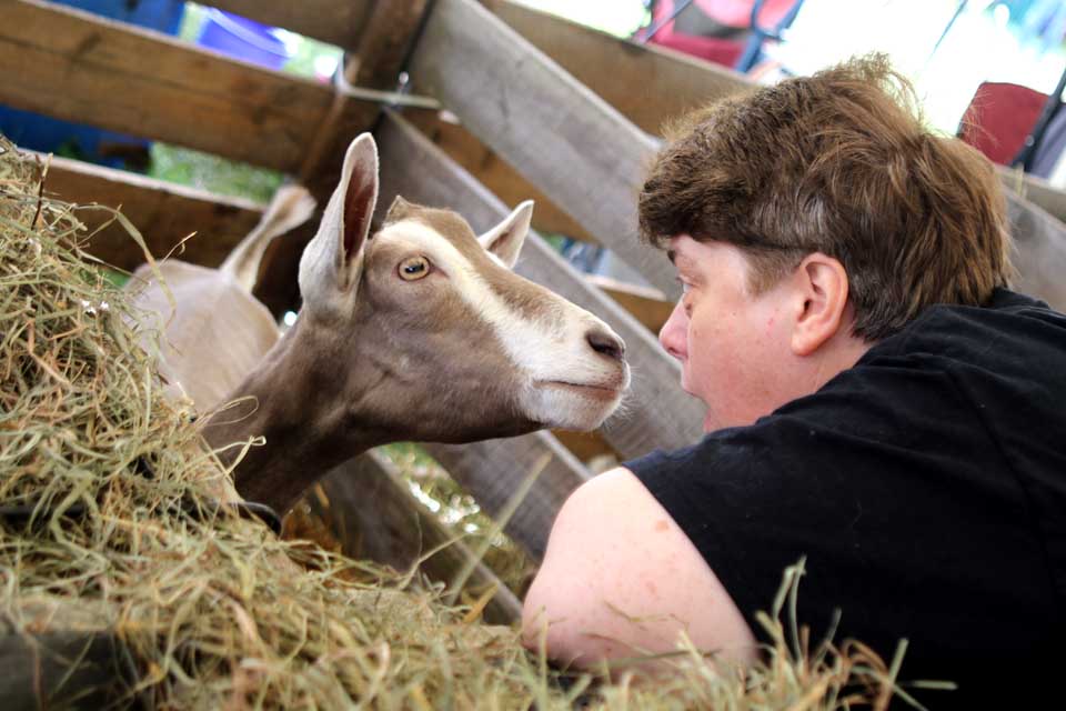 Kelly Steele, Cooperstown, makes friends with Jean Eugenia the goat. “I came here for the hugs and kisses!” said Steele. I grew up on our families’ farm but my father sold our farm after 30 years. I always wanted goats, so I come here!”