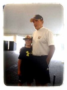 Lou Presutti – "coach," and he was known to the tens of thousands of youngsters who competed at Dreams Park over the years, poses with an attendee.