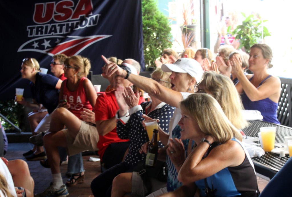 Onlookers filled the Hard Ball Cafe in Cooperstown this morning to watch Sarah Groff True compete in the Women's Olympic Triathelon. Although her bid was cut short by a fall, those gathered still expressed their pride in Otsego's Olympian (Ian Austin/AllOTSEGO.com