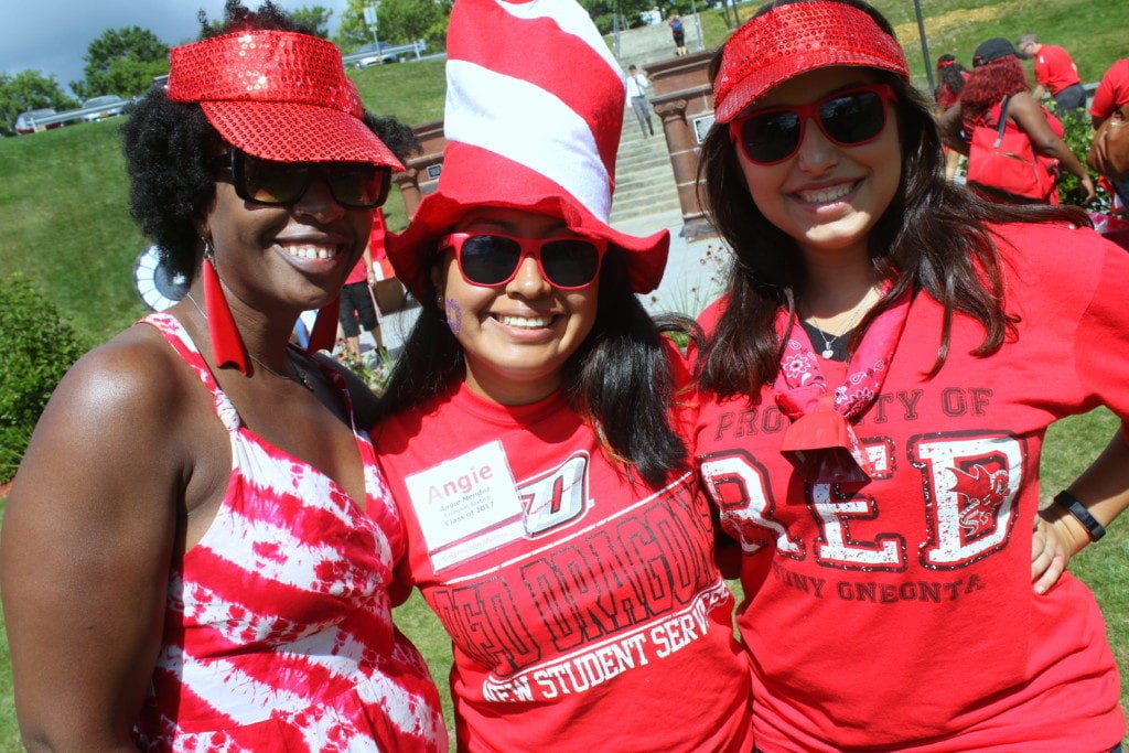 Dr. Marita Gilbert, left, pauses to show her school spirit with SUNY seniors Angie Mende and Lauren Kelly during the colleg's 8th annual Red Day celebration. The day of festivities, held in the campus quad in honor of the school's founding on September 4th, 1889, features games, swag, caricatures, tee-shirt making and more for students looking to show off their SUNY Oneonta pride. (Ian Austin/AllOTSEGO.com) 