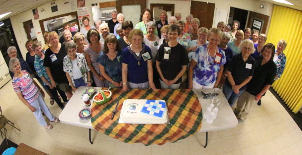 The ladies of the Susquehanna Valley Quilters gather for a photo before cutting the cake to celebrate the group's 30th birthday this evening at Elm Park Methodist Church. (Ian Austin/AllOTSEGO.com)