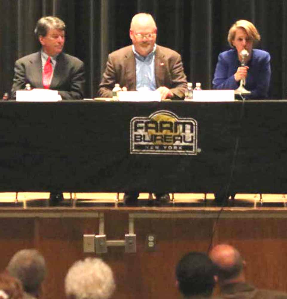 Congressional candidates at a Farm Bureau forum in Oneonta last May.  Republican John Faso is to the left of the moderator; Democrat Zephyr Teachout to the right.  (AllOTSEGO.com photo)
