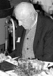 Henry S. Kernan signs copies of his book,