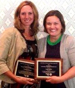 Patricia Leonard, left, and Angie Eichler show off their plaques.