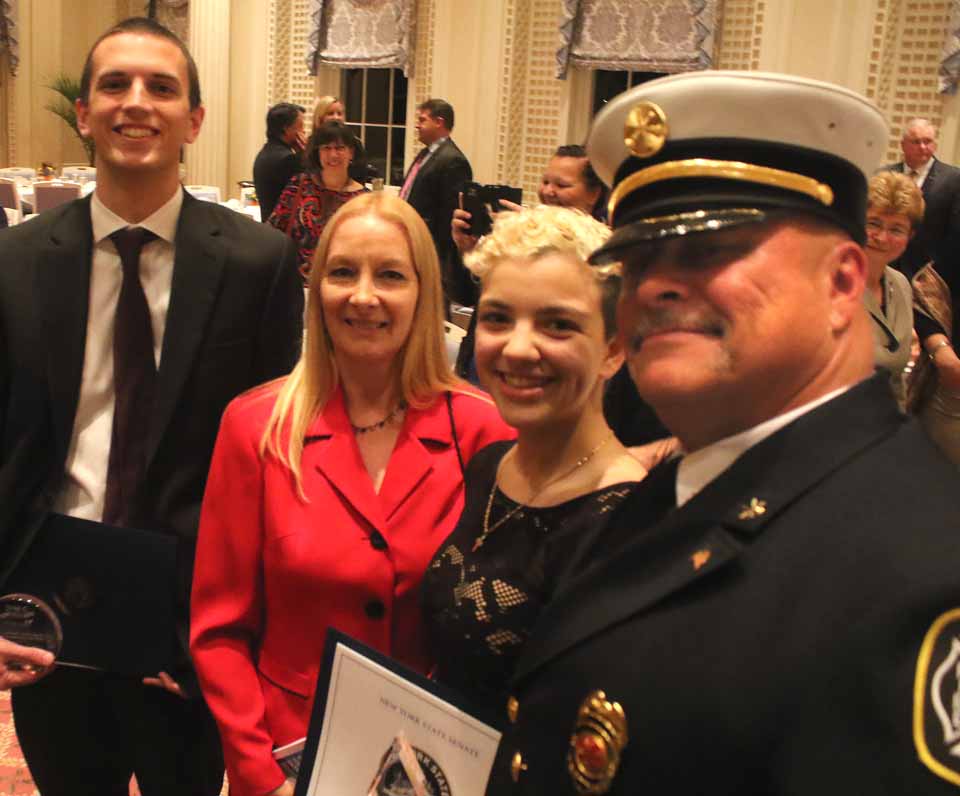 This year, the chamber honored participants in their college internship program. From left are Ryan zz , SUNY Oneonta, with Michelle Catan of the Small Business Development Center, where he interned; and Demi Manesis of Hartwick College, with Assistant Fire Chief Jim Maloney of the Oneonta Fire Department, where she interned. Both are senior economics majors. 
