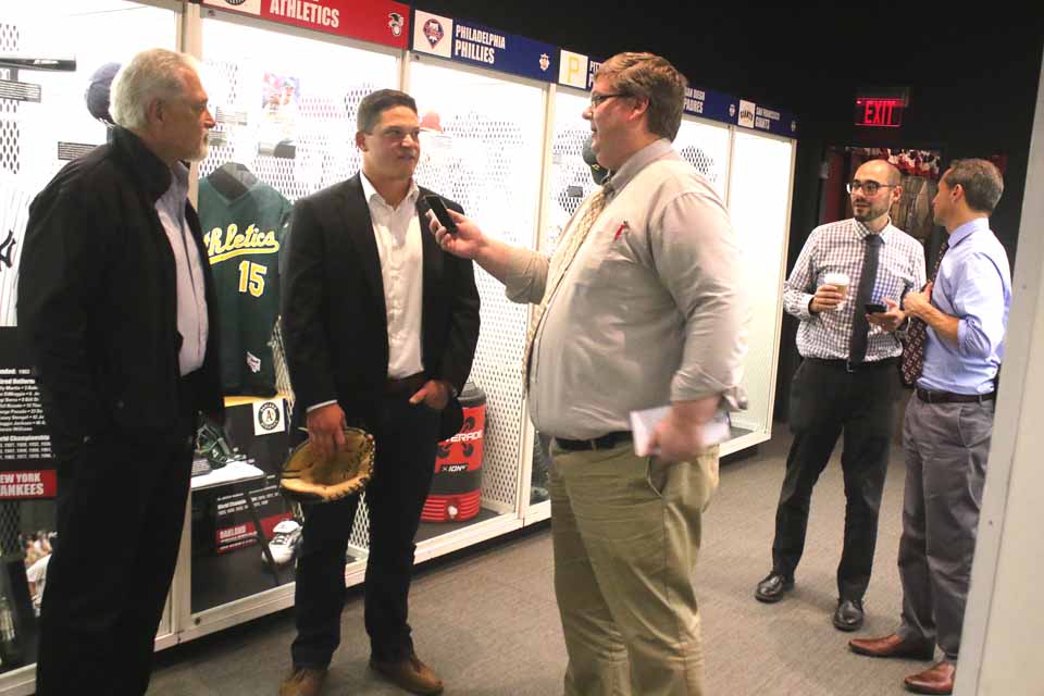 Cooperstown native Phil Pohl this afternoon donated memorabilia from his Major League career, including his catcher's mitt, to his hometown's baseball mecca, the Hall of Fame. Here, the Oakland A is interviewed by the Hall's Bill Francis, while his dad Bruce, left, looks on. At right are Hall President Jeff Idelson and Jon Sthe Vice President of Communications Jon Shestakofsky. Phil then met with local fans, including the CCS Varsity Baseball Team, in a packed Bullpen Theater to answer questions about his career. (Jim Kevlin/AllOTSEGO.com)