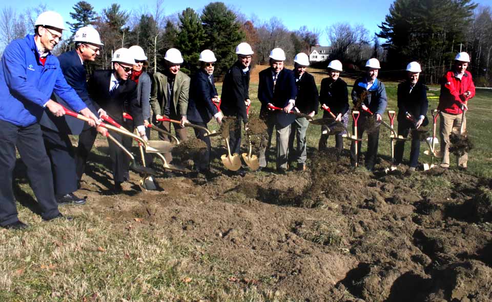A ceremonial groundbreaking this morning launched construction of Farm Credit East’s 50-job regional headquarters on Route 80 (West Lake Road), Town of Springfield, a quarter-mile north of the Glimmerglass Festival. When complete in a year, the office will combine Farm Credit’s Sangerfield and Cobleskill offices. Participating were, from left, Sangerfield manager Craig Pollock; Ken Rizzo, Sano-Rubin Construction, Albany; Dave Hollander, Sano-Rubin president; Theresa Drerup and Kurt Ofer, principals in Altonview Architects, Cooperstown; John Camp, C&S Engineers, Syracuse; attorney Doug Zamelis, Springfield; Bill Elsey, Springfield town supervisor; Priscilla Barry, chair, Springfield town Planning Board; Cobleskill manager Rob Hurkewecz; Dave Pugh, director, Farm Credit’s country living loans; Skip Hardie, Lansing, Farm Credit board member, and Cooperstown native Mike Reynolds, Farm Credit executive vice president, now based in New Jersey. On the hill in the background is the former mansion of the Ryerson family, which owned the property for decades. Nearby, a crew from Barney & Sons, Morris, was drilling the well for the project. (Jim Kevlin/AllOTSEGO.com)