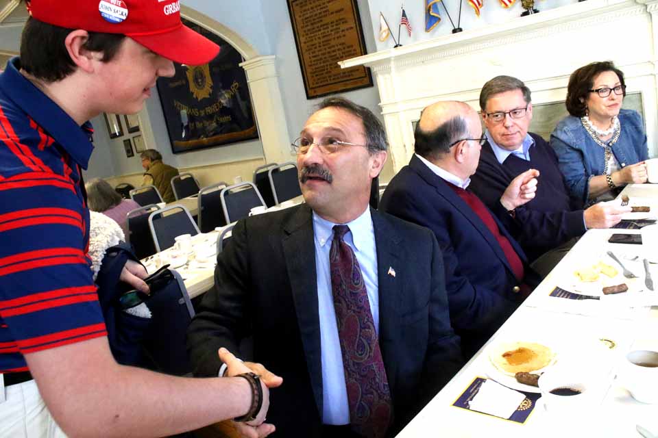 John Salka, the Brookfield town supervisor and Madison County legislator who is challenging Assemblyman Bill Magee, D-Nelson, for hte 121st District seat, shakes hands with Bobbie Walker, founder of the Otsego County Young Republicans, at the Cooperstown Rotary Club's pancake meal at the Vet's Club. Behind him is Tony Casale, the retired assemblyman, and state Sen. Jim Seward, R-Milford, and wife Cindy. Seward is being challenged by Democrat Jermaine Bagnall-Graham of Sherburne. Also on the ballot are Republican John Faso and Democrat Zephyr Teachout, vying to succeed Congressman Chris Gibson in the 19th District. (By the way, the Rotary is serving pancakes until 2 p.m., and again from 4 to 7 p.m.) (Jim Kevlin/AllOTSEGO.com)