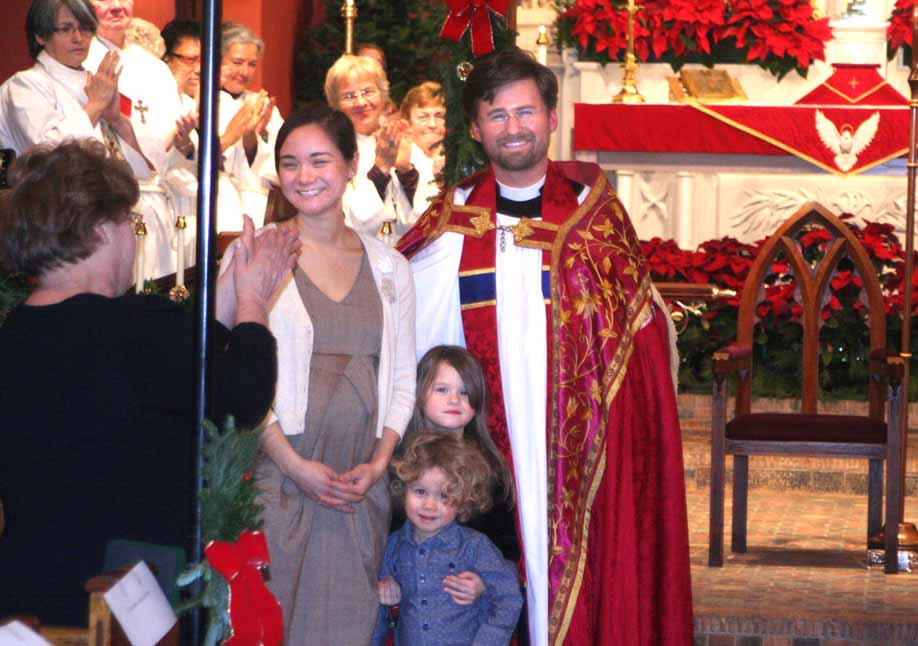 The Rev. Dane E. Boston, his wife Debbie and their children, accept parishioners' applause during his induction this evening as the 23rd rector of Christ Episcopal Church, Cooperstown.  Father Boston arrived in September from Columbia, S.C., where he was canon at Trinity Episcopal Cathedral.  The Right Rev. William H. Love, bishop of the Albany Diocese, officiated.  Father Boston succeeds the Rev. Mark Michael, who took a position in Virginia.  (Jim Kevlin/AllOTSEGO.com)