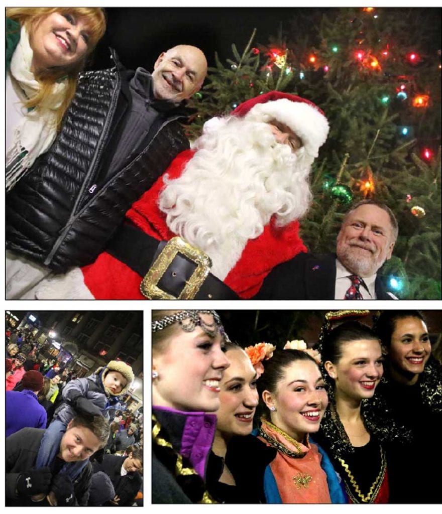 Hundreds turned out again this evening for the community treelighting in downtown Oneonta, a highlight of the season in the City of the Hills.  In top photo, posing in front of the just-lit tree are, from left, Santa's elf Allison Green, Mayor Gary Herzig (just back from last night's tree lighting at Rockefeller Center), You Know Who and Oneonta Town Supervisor Bob Wood.  The four soloists in the upcoming Fokine Ballet "Nutcracker" – from left, Hannah Reynolds, Rose Wake, Gabriella Basdekis and Siarra Goodhue – flashing winning smiles at passing fans.  Lower left, Keegan Head, 16 months, of Oneonta, peers from his dad Kevin's shoulders at the tree-lighting fun. (Jim Kevlin/AllOTSEGO.com)